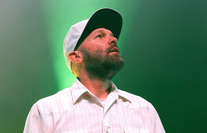 Fred Durst of Limp Bizkit wearing a white baseball cap.