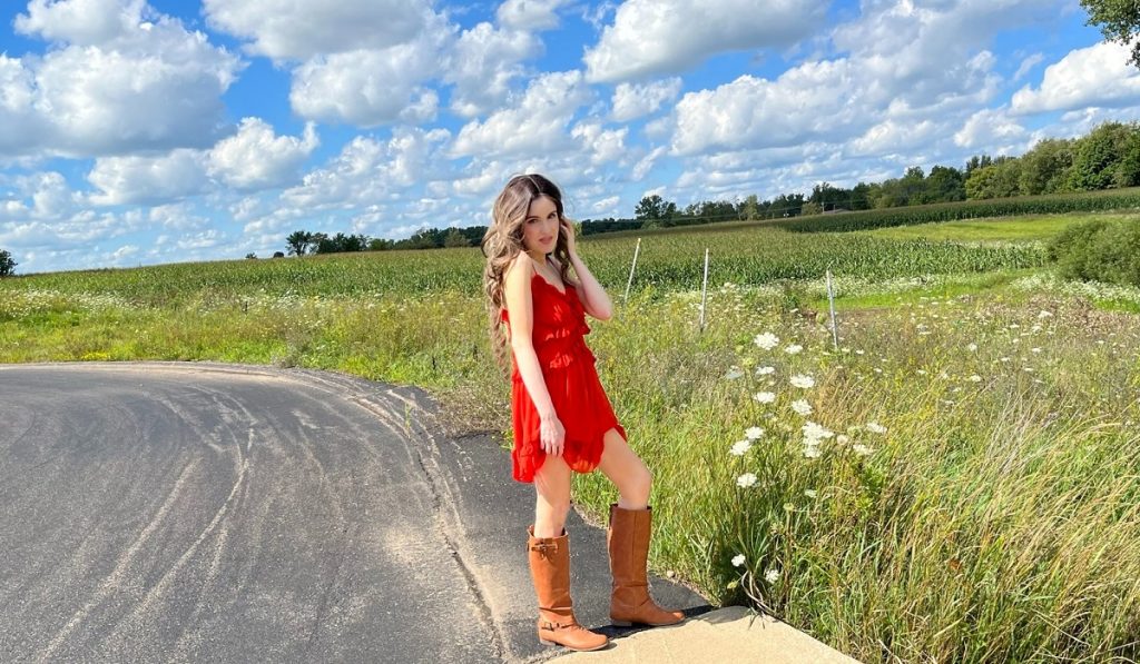 Anne Erickson standing in a farm.